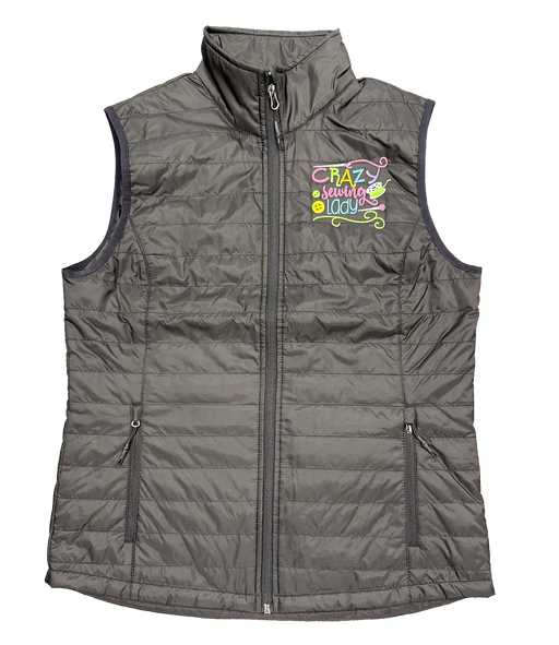 Black puffy vest with 'Crazy Sewing Lady' embroidery designed by Dawn Chase, featured on Stitch It Live TV