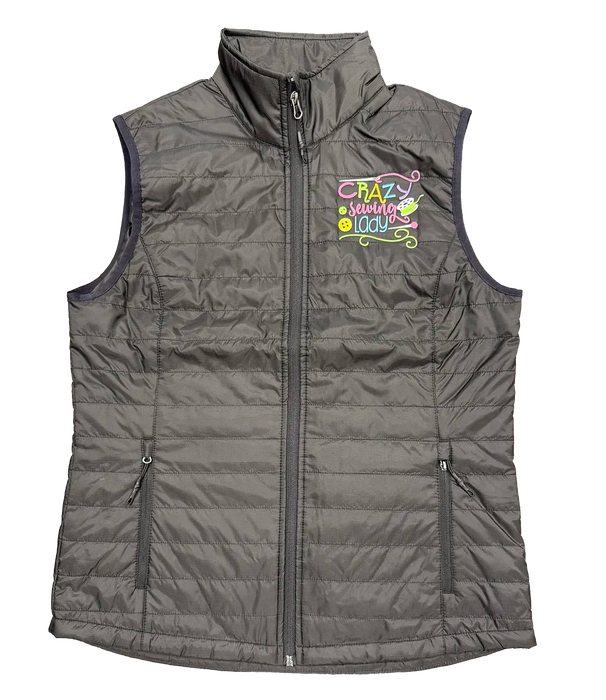Black puffy vest with 'Crazy Sewing Lady' embroidery designed by Dawn Chase, featured on Stitch It Live TV