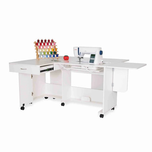 Arrow Christa Sewing Cabinet in White with sewing machine and thread rack displayed, showcasing expanded quilt leaves and workspace.