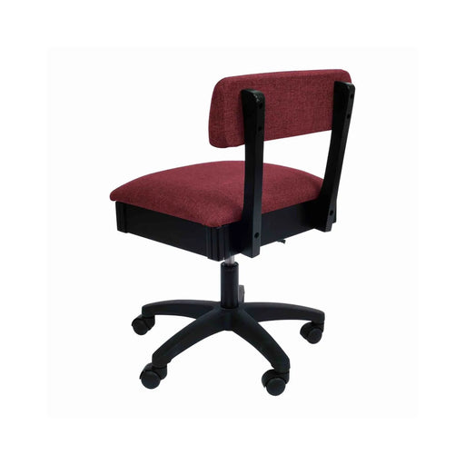 Arrow Madame Scarlet Hydraulic Sewing Chair – rear angle view showing rich red woven fabric, supportive backrest, and smooth-rolling caster wheels.