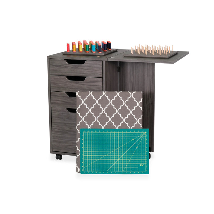 Kangaroo Sewing Furniture Kiwi Cabinet with expanded cutting surface, thread organizer tray, and included ironing board cover and cutting mat in gray finish.