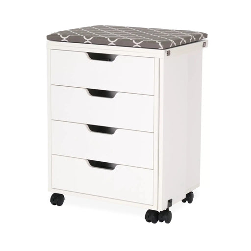 Arrow Shirley Storage Cabinet White 441 closed view showing four storage drawers, cushioned ironing board top, and mobile caster wheels for compact sewing room storage.