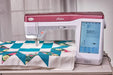 Baby Lock BLAN Anthem quilting and sewing machine working on a teal and pink quilt project