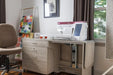 Baby Lock Anthem BLAN sewing machine set up in a home sewing studio on a lift sewing cabinet