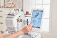 User operating the Baby Lock Array touchscreen to edit embroidery design on 6-needle embroidery machine