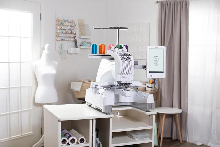 Baby Lock Array 6-needle embroidery machine set up in home sewing studio with embroidery workstation