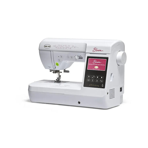 Baby Lock Bloom BLMBM sewing and embroidery machine angled view showing control panel and stitching workspace.