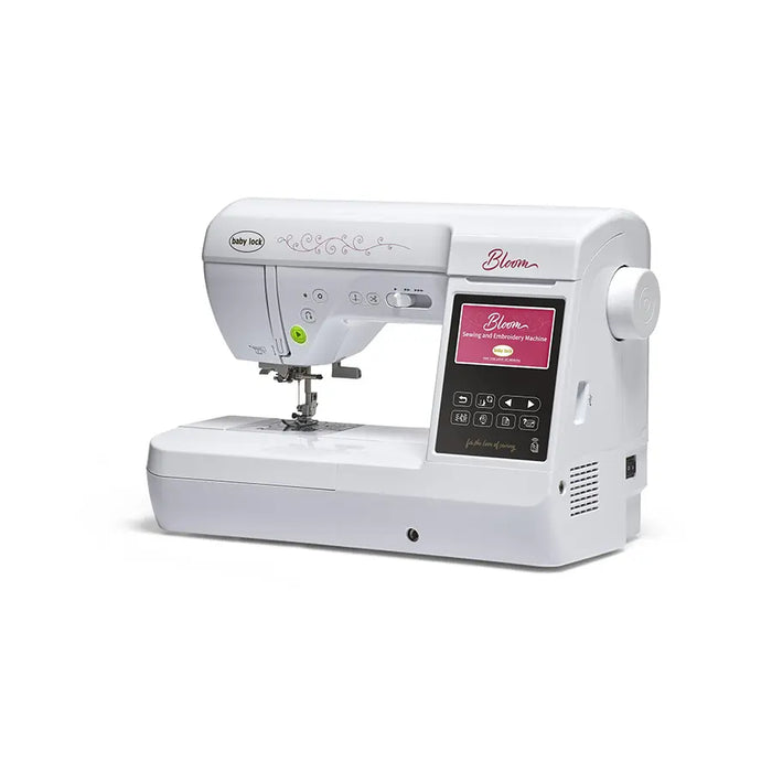Baby Lock Bloom BLMBM sewing and embroidery machine angled view showing control panel and stitching workspace.