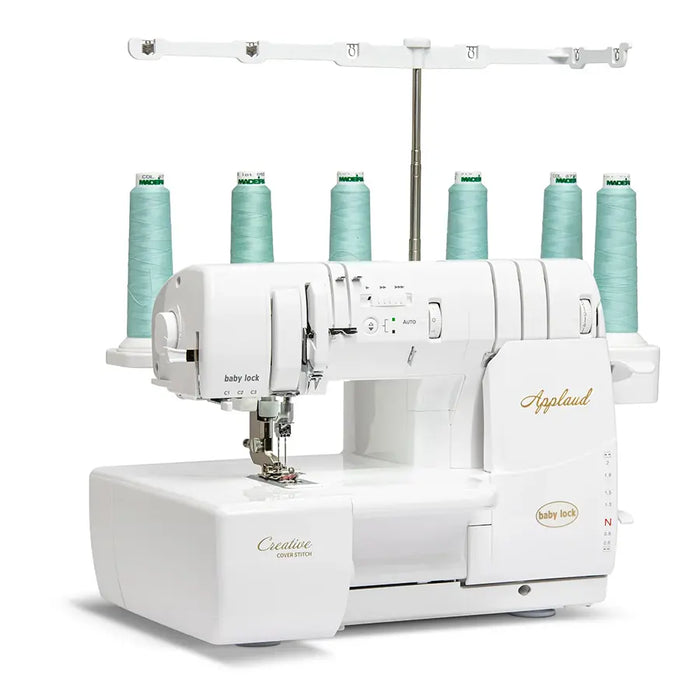 Baby Lock BLP6 Applaud Creative Cover Stitch machine angled display highlighting top cover stitch system and multi-thread functionality.