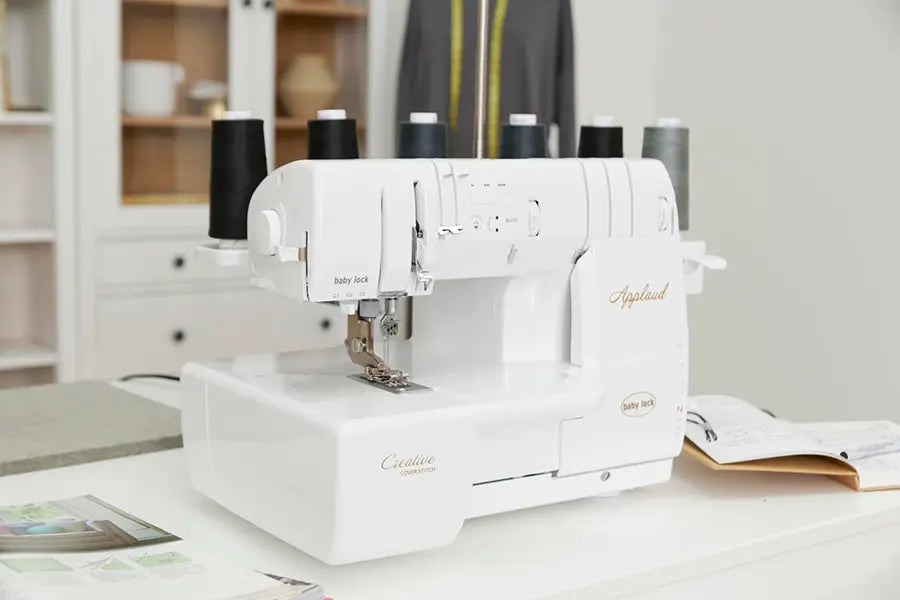 Baby Lock BLP6 Applaud serger positioned in a sewing workspace, demonstrating professional cover stitch machine setup.