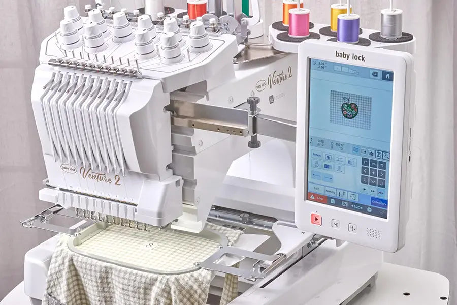 Baby Lock Venture 2 embroidery machine touchscreen showing design editing tools and multi-needle threading system.