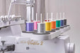 Thread spool rack on the Baby Lock Venture 2 multi-needle embroidery machine displaying colorful embroidery threads.