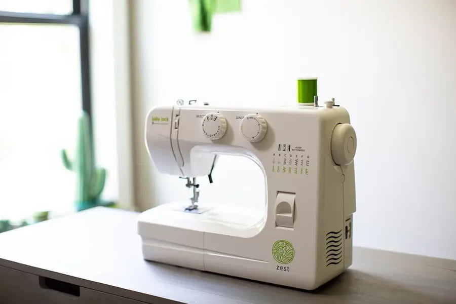 Baby Lock Zest BL15B mechanical sewing machine displayed on table in bright sewing room with natural lighting.