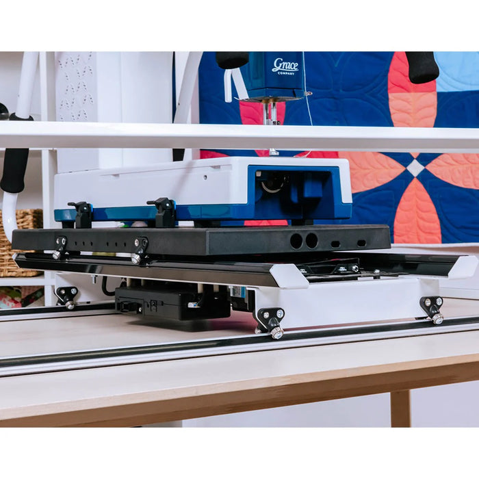 Underside view of Grace Cutie Breeze quilting frame carriage and track system for smooth motion quilting
