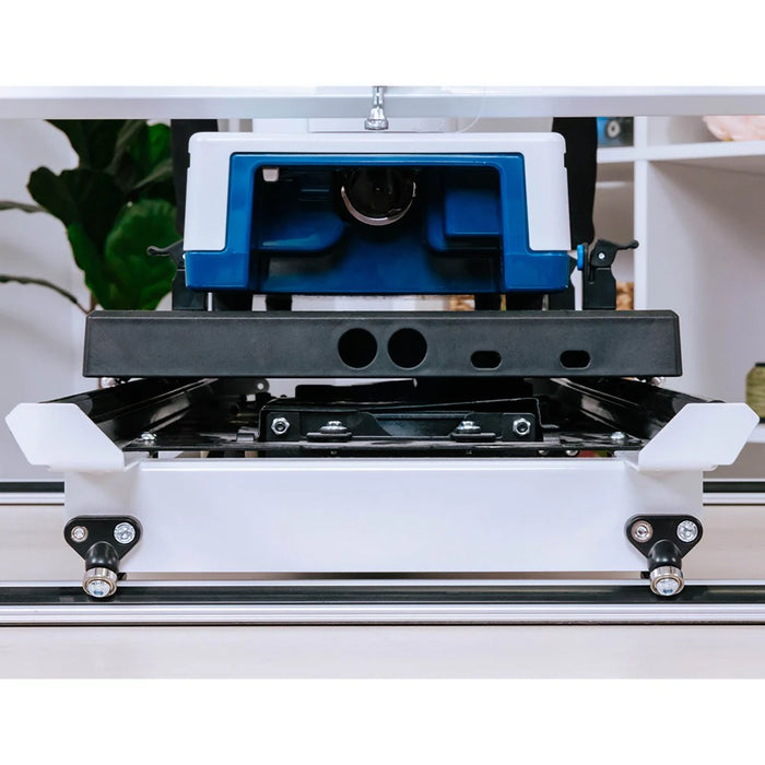 Close-up of Grace Cutie Breeze rolling carriage and track system for smooth machine movement