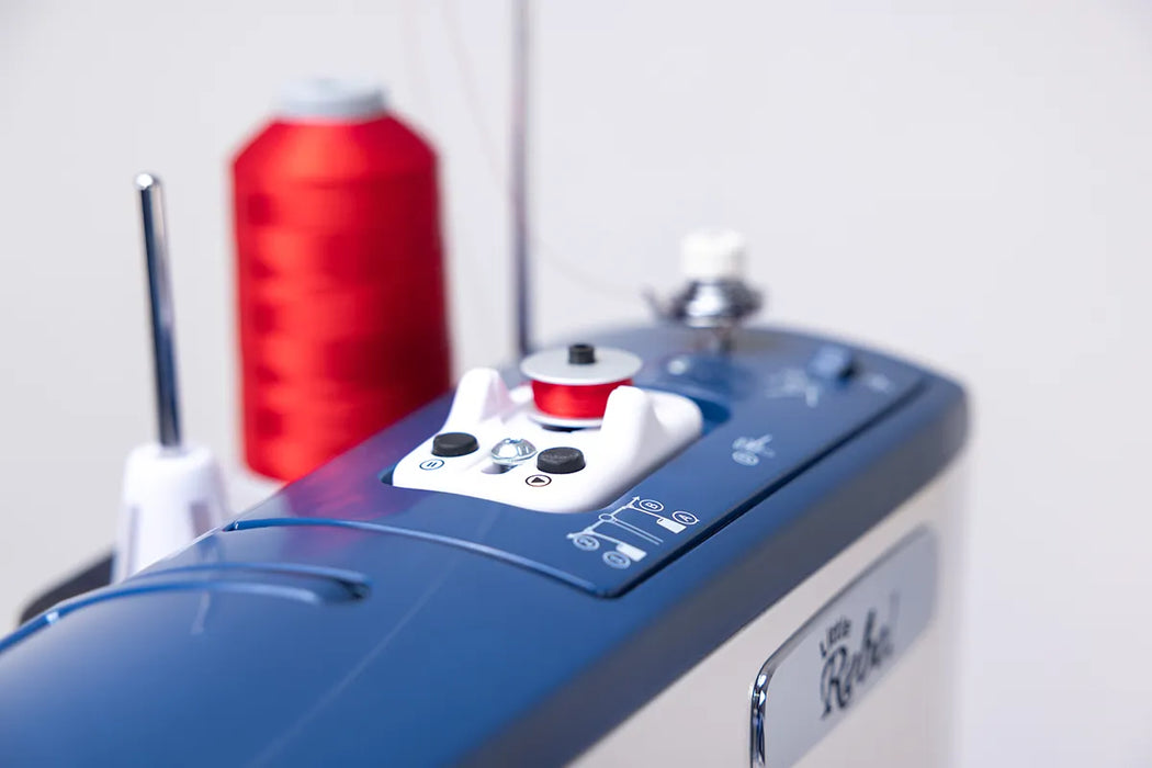 Top control panel of Grace Little Rebel quilting and sewing machine with stitch regulation buttons and bobbin winder