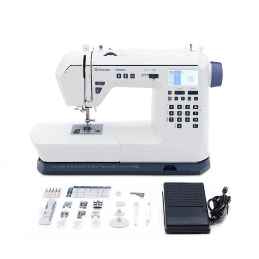 Husqvarna Viking Onyx 30 sewing machine with included accessories, presser feet, bobbins, foot pedal, power cord, and sewing tools