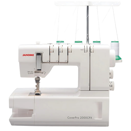 Front view of the Janome CoverPro 2000CPX coverstitch machine with four-thread setup, showing tension dials and stitch area for professional hemming.
