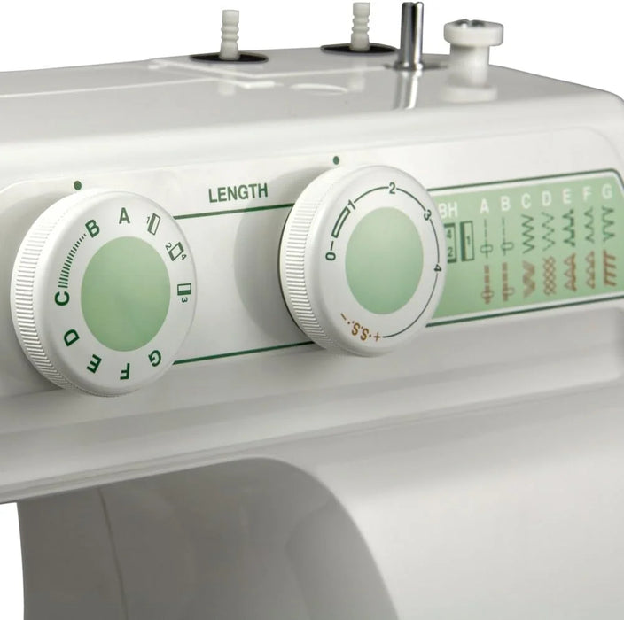 Close-up of Janome 2212 stitch selector and length control dials with built-in stitch guide.