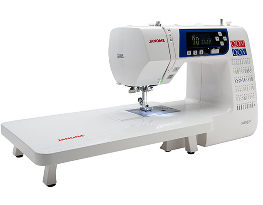 Janome 3160QOV sewing machine with extended quilting table attachment for larger quilting projects