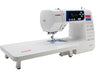 Janome 3160QOV sewing machine with extended quilting table attachment for larger quilting projects