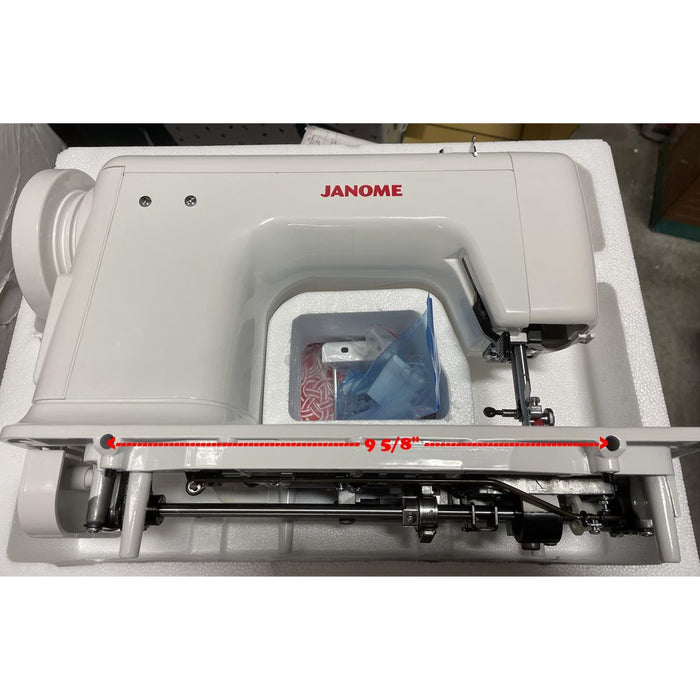 Underside view of Janome 712T treadle sewing machine with 9 5/8-inch mounting hole measurement for treadle cabinet installation.