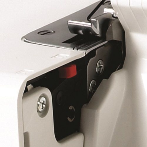 Close-up of Janome 8002D Serger upper knife mechanism featuring precision cutting blade for clean fabric edges.