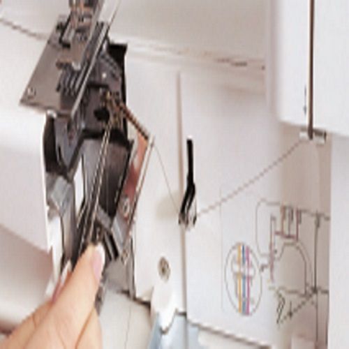 Close-up of the Janome CoverPro 900CPX internal looper area showing threading access and maintenance features for coverstitch sewing.