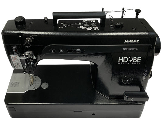 Top view of Janome HD9V2BE Professional Sewing Machine in black, highlighting controls and stitch plate area
