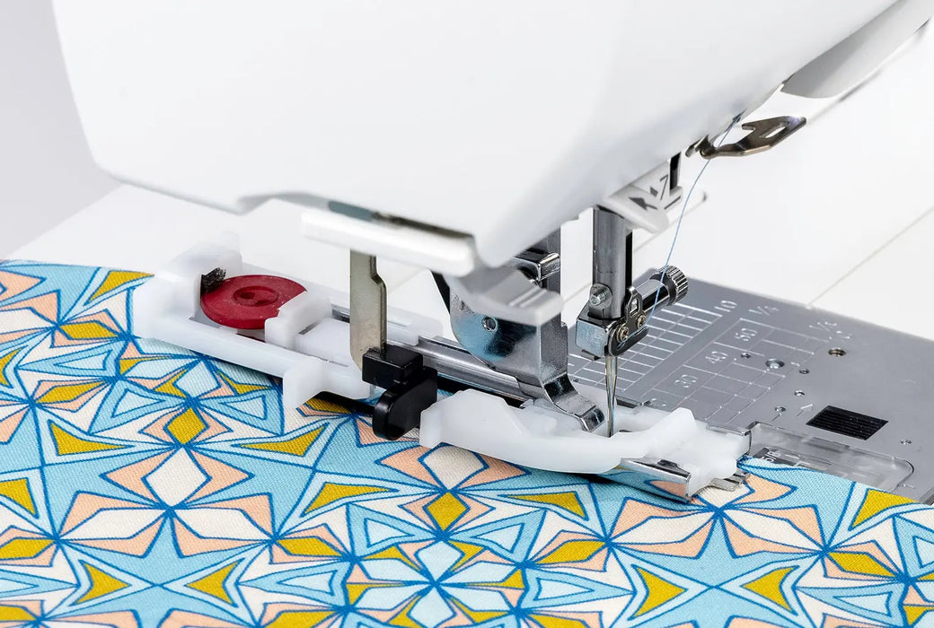 Janome Memory Craft 1000 sewing machine using buttonhole foot to stitch decorative fabric with precision