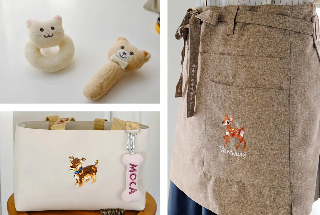 Finished embroidery projects made with the Janome Memory Craft 1000 including baby toys, embroidered bag, and apron design