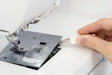 Removing the stitch plate on the Janome Memory Craft 1000 for cleaning and maintenance
