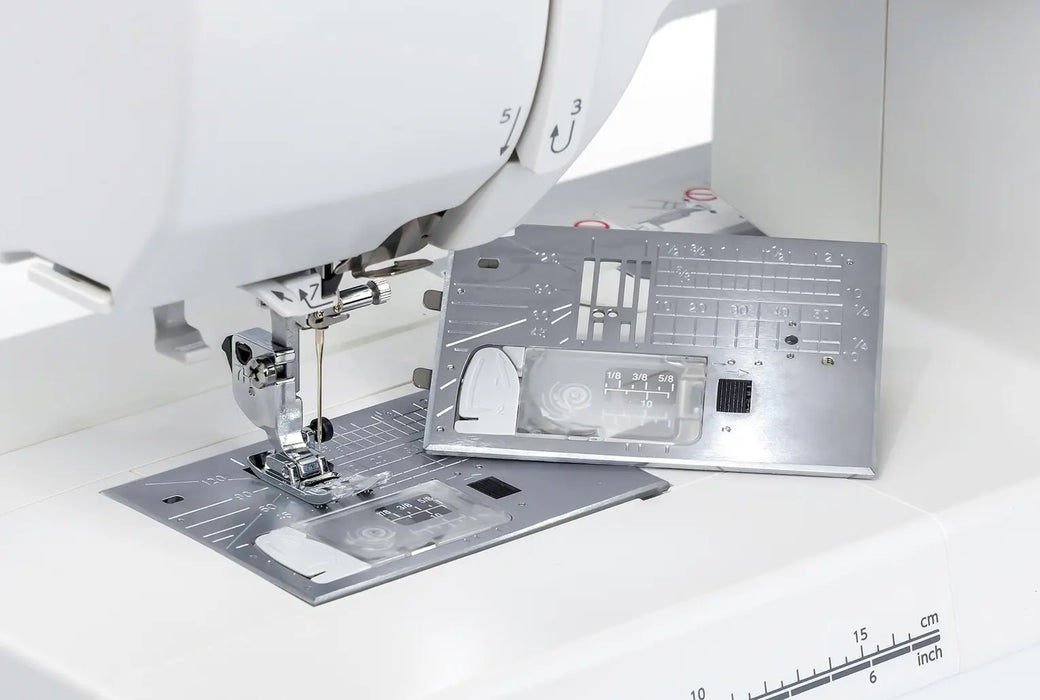Janome Memory Craft 1000 detachable stitch plates shown for sewing and embroidery functionality

10. janome-MC1000-sewin