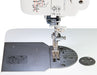 Close-up of Janome HD9V2 needle area, stainless-steel needle plate, and precision stitch markings for accurate sewing.