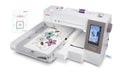 Janome MC550E Limited Edition embroidery machine with large hoop installed and AcuStitch software box shown beside it.