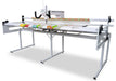 Janome Quilt Maker 18 long arm quilting machine on ProFrame 8 shown from front angle, featuring 18-inch throat space and smooth fabric handling