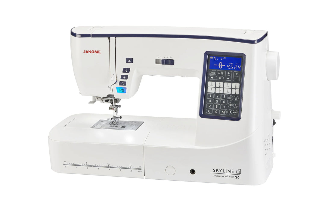 Janome Skyline S6 Anniversary Edition computerized sewing machine with illuminated screen and wide sewing platform.