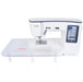 Janome Skyline S7 Anniversary Edition with included extension table for expanded sewing and quilting workspace.