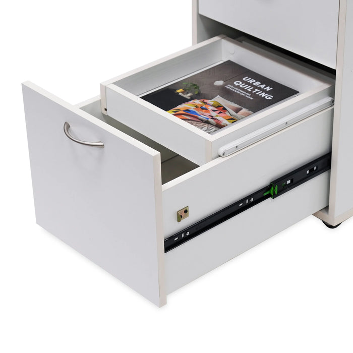 Bottom drawer of Kangaroo Adelaide Storage Cabinet K4731 open with removable accessory tray holding quilting book for organized storage.