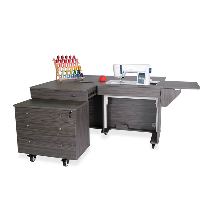 Kangaroo & Joey Sewing Cabinet in modern gray finish with hydraulic lift, expanded work surface, and rolling storage caddy for sewing and quilting studios.