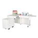 Kangaroo & Joey Sewing Cabinet in white finish with hydraulic lift, extended quilt leaf, and rolling Joey storage caddy for sewing and quilting studios.