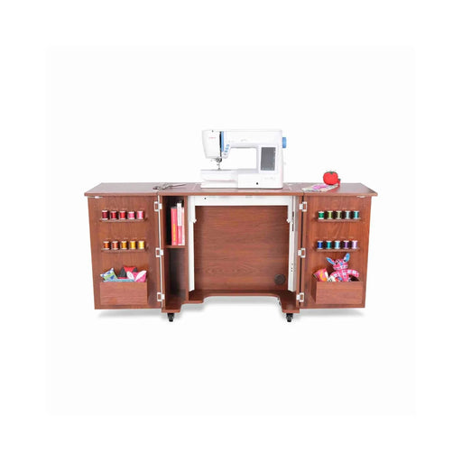 Kangaroo Bandicoot Sewing Cabinet in Teak K8205 shown with hydraulic lift raised, sewing machine on flatbed surface, and door storage for thread and notions.