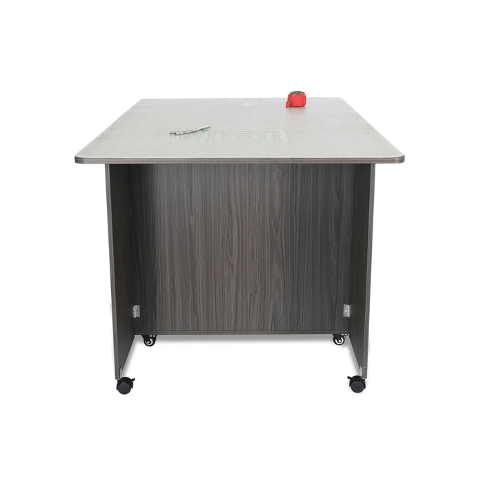 Rear view of the Gray Kangaroo Kookaburra Cutting Table showing sturdy back panel and caster wheels for mobility.