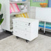Ash White Kangaroo Joey Storage Cabinet K7811 displayed in a sewing studio, offering mobile storage for craft and quilting supplies.