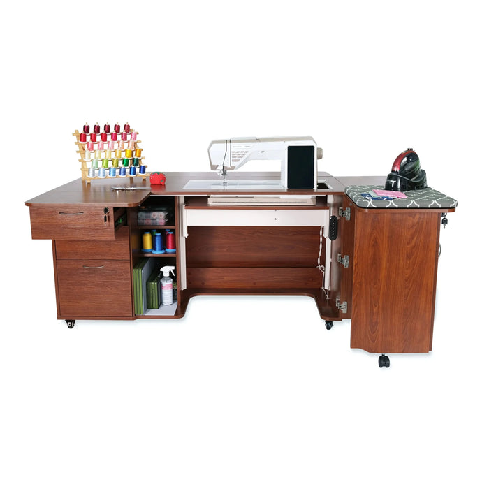 Kangaroo Sydney Dual Rail Electric Sewing Cabinet open with sewing machine installed, expandable work surface, storage drawers, and ironing station in teak finish.