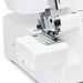 Close-up of SINGER SE017 Elite serger needle area and presser foot for precision overlock stitching and clean fabric edges