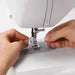 Close-up of built-in needle threader on SINGER Brilliance 6180 sewing machine for easy threading