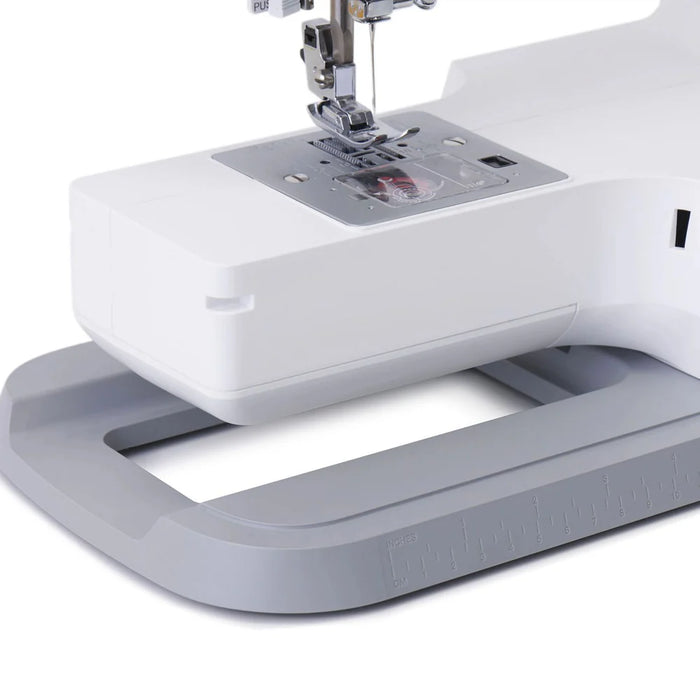 Close-up of SINGER Elite ME457 sewing machine needle plate and free arm for precise stitching and hemming