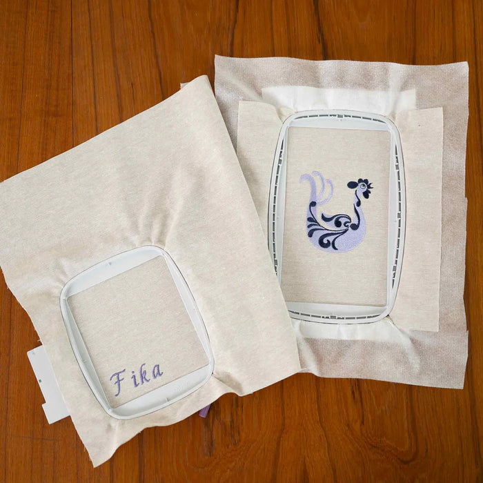 Husqvarna Viking Designer Quartz 29 embroidery hoops with stitched embroidery samples on fabric