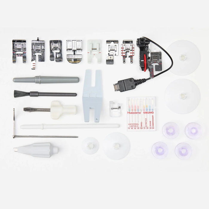 Included accessories and presser feet for Husqvarna Viking Designer Topaz 65 sewing and embroidery machine